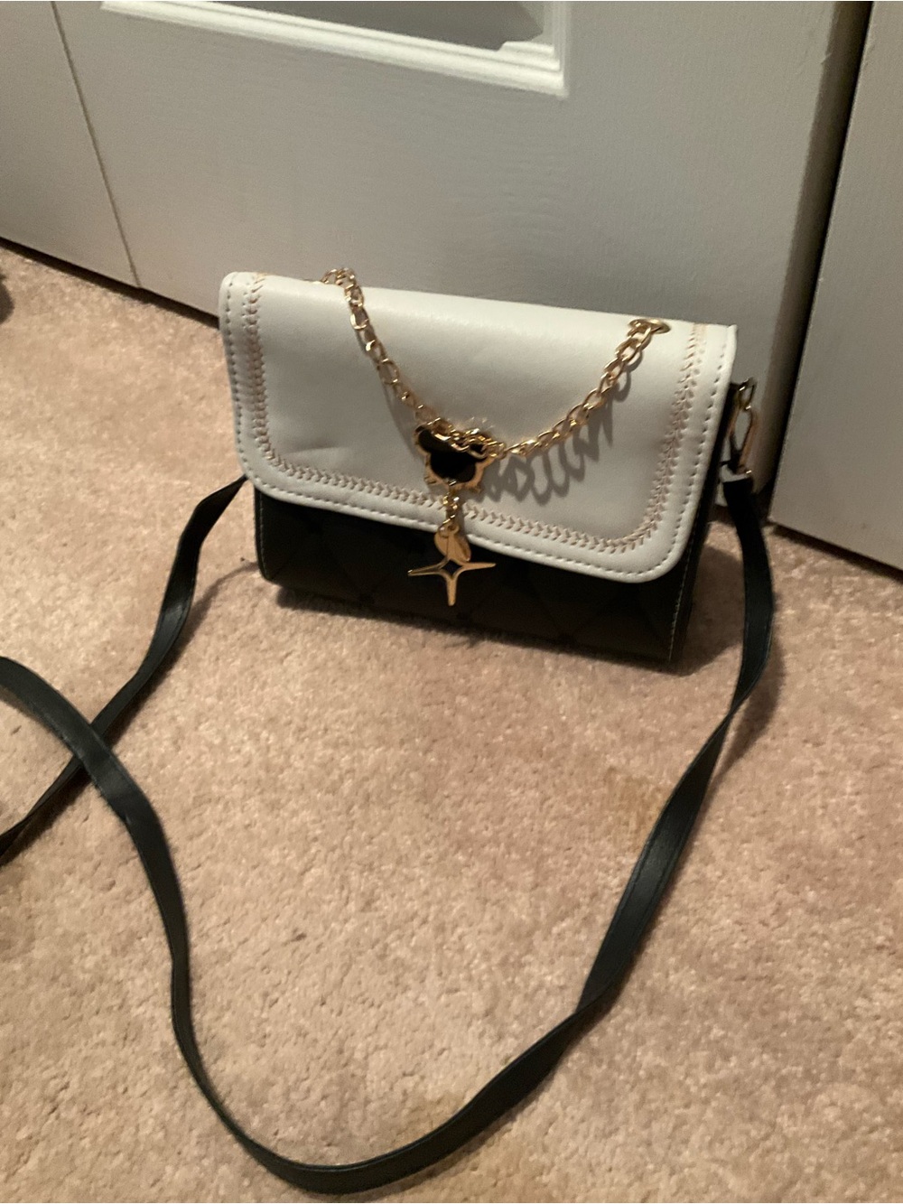 White and Black Crossbody Bag with Gold Chain Accent